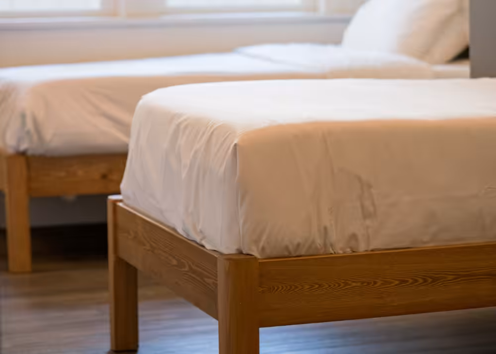 Clean, comfortable resident bedroom with two beds